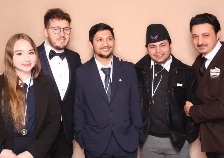 Fabrizio with employees in a party